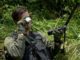 SERE Specialist helps Pilot Using Survival Mirror (photo by Airman Shawna L. Keyes, USAF, Aug 5, 2016)