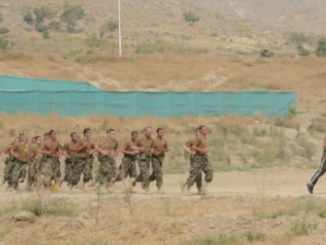 Cadets running at the ANAOA. (Photo by SSG Richard Andrade, ISAF, 23 Oct 2013).