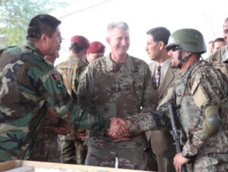 20171023 - MG Bismellah Waziri, Afghan National Army Special Operations Command commander,, congratulates the Commando Qualification Course student company commander on his mission brief to ANASOC and NATO Resolute Support leadership at Camp Commando, Kabul on Oct. 21, 2017. (Photo Jacob Krone, NSOCC-A).