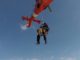A Canine Explosive Detection Team of the U.S. Coast Guard conducts hoist training with MH-65 Dolphin helicopter and CG boat crew. (Photo PO 3rd Class Ryan Dickinson, USCG, March 29, 2018).