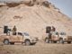 Syrian Democratic Forces (SDF) provide security for a Coalition mortar crew providing fires support to SDF against ISIS locations in Operation Round Up taking place in the Middle Euphrates River Valley (MERV) in Syria. (photo by SSG Timothy Koster, CJTF-OIR, May 13, 2018).