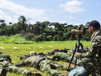 A Colombian competitor uses his Data of Previous Engagement (DOPE) during the zeroing of weapons for this year's Fuerzas Comando, July 15, 2018 on a shooting range in Panama City, Panama. Fuerzas Comando is an annual multinational special operational forces skills competition sponsored by U.S. Southern Command and hosted this year by the Ministry of Public Security, Panama. Through friendly competition, this exercise promotes interoperability, military-to-military relationships, increases training knowledge, and improves regional security. (U.S. Army Photo by Staff Sgt. Brian Ragin/Released)