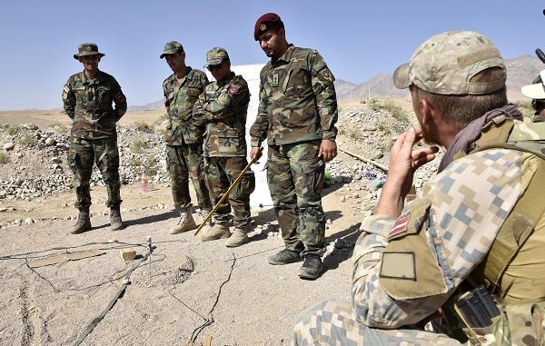Latvian SOF is briefed by an Afghan officer assigned to a Mobile Strike Kandak during the Cobra Strike Maneuver Course near Kabul. Photo by MSG Felix Figueroa, NSOCC-A, Sep 2018.