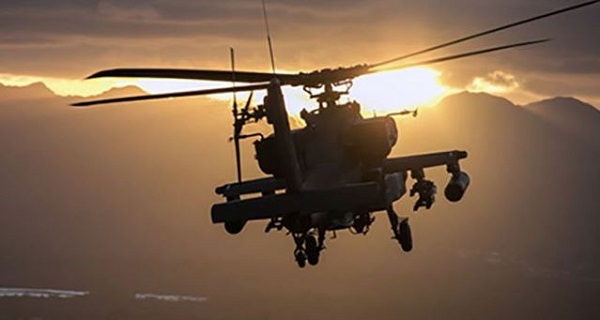 A U.S. Army AH-64 Apache helicopter flies at Schofield Barracks, Hawaii, Dec. 17, 2018. (U.S. Army photo by 1st Lt. Ryan DeBooy)