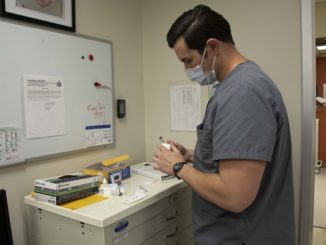 1st SFG 18D Medic Prepares Medication